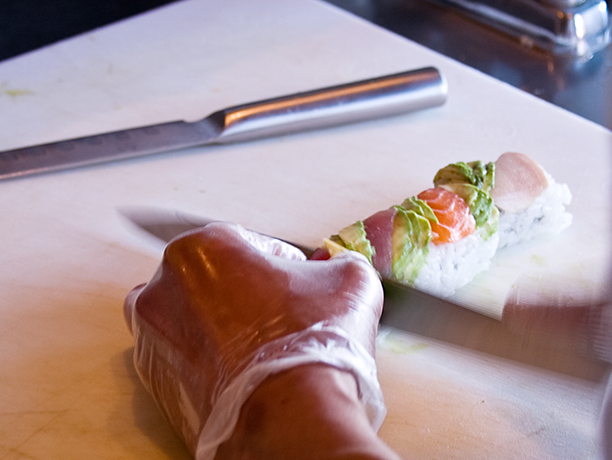 preparing sushi roll