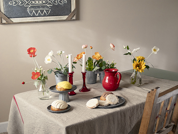 table with flowers and pastries